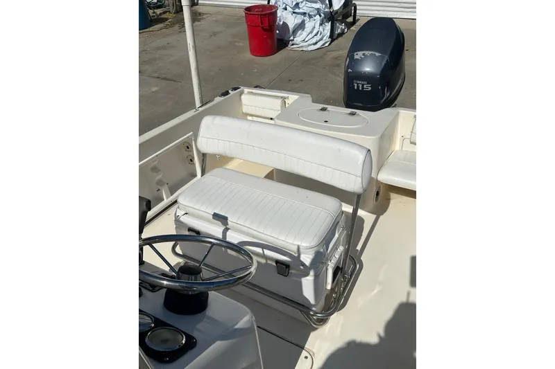 Slide: The Image of 2005 Sea Hunt Triton 186 boat interior with steering wheel and Yamaha 115 outboard motor. - 20