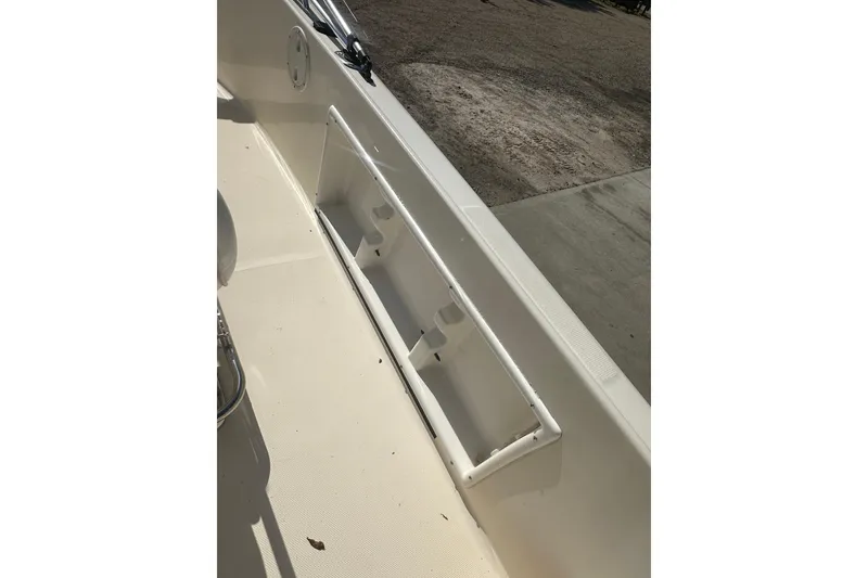 Slide: The Image of 2005 Sea Hunt Triton 186 boat interior with rod holder and clean deck. - 23