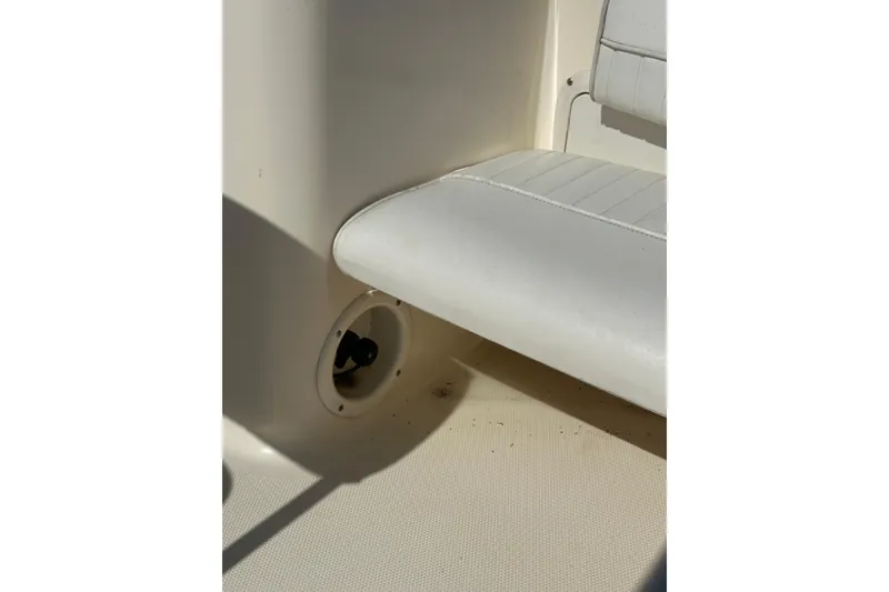 Slide: The Image of 2005 Sea Hunt Triton 186 boat interior with white seating and floor detail. - 26