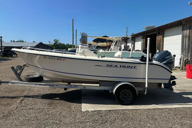 Slide: The Image of 2005 Sea Hunt Triton 186 boat on trailer, parked outdoors. - 9