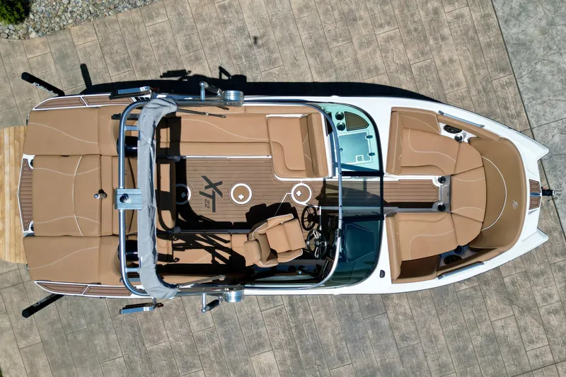 Slide: The Image of Overhead view of 2020 MasterCraft XT22 boat with tan seating and sleek design. - 13