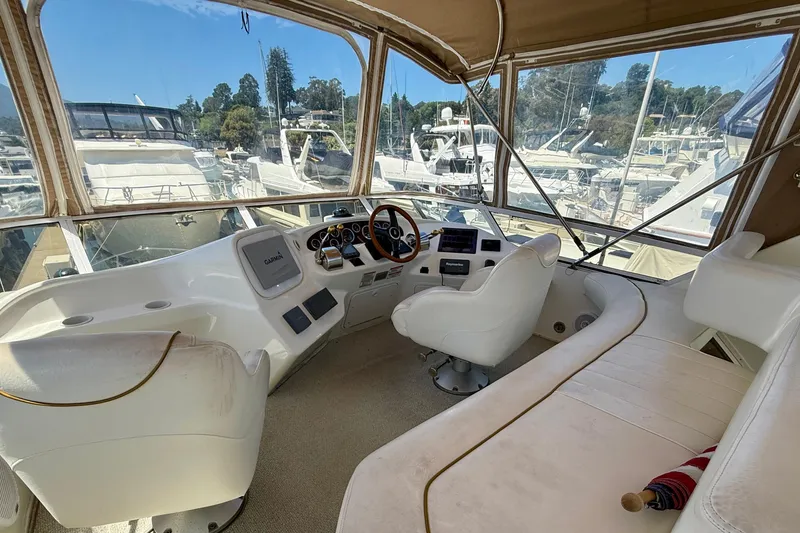 Slide: The Image of Cockpit of 2000 Sea Ray 380 Aft Cabin yacht with marina view. - 11