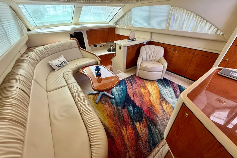 Slide: The Image of Luxurious interior of 2000 Sea Ray 380 Aft Cabin yacht with plush seating and vibrant rug. - 14