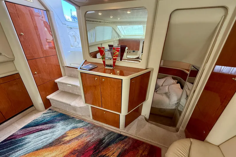 Slide: The Image of Luxurious interior of 2000 Sea Ray 380 Aft Cabin yacht with elegant wood finishes. - 17
