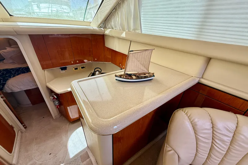 Slide: The Image of Luxurious interior of 2000 Sea Ray 380 Aft Cabin yacht with elegant wood finishes. - 18