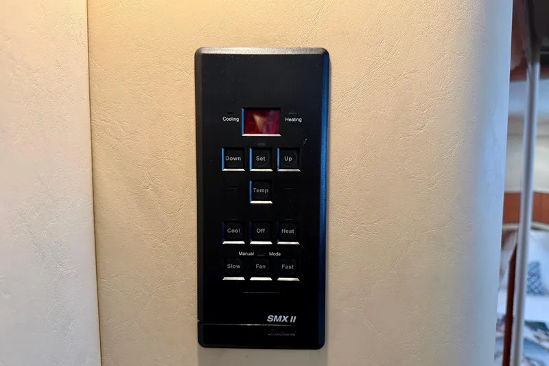 Slide: The Image of Control panel on a 2000 Sea Ray 380 Aft Cabin yacht interior. - 26