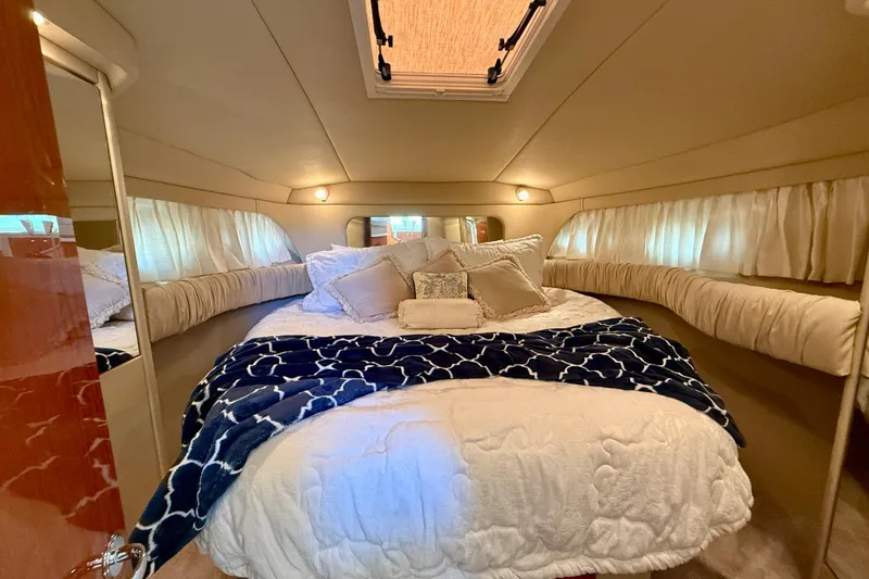 Slide: The Image of Luxurious cabin interior of 2000 Sea Ray 380 Aft Cabin yacht with cozy bedding. - 30