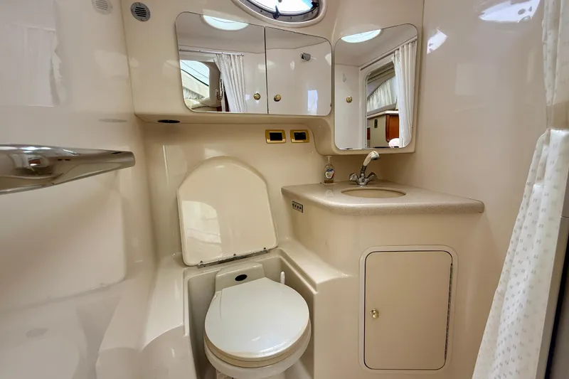 Slide: The Image of Bathroom interior of 2000 Sea Ray 380 Aft Cabin yacht, featuring toilet and sink. - 34