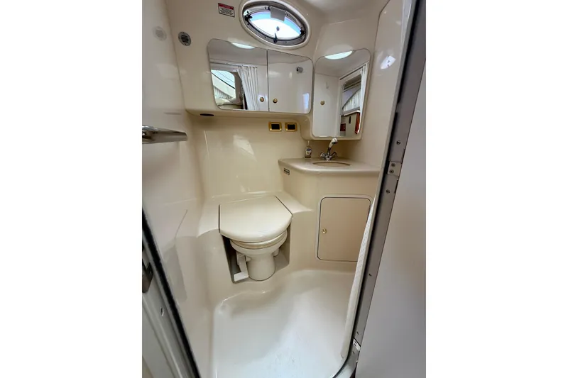 Slide: The Image of Compact bathroom in 2000 Sea Ray 380 Aft Cabin yacht, featuring toilet and sink. - 35