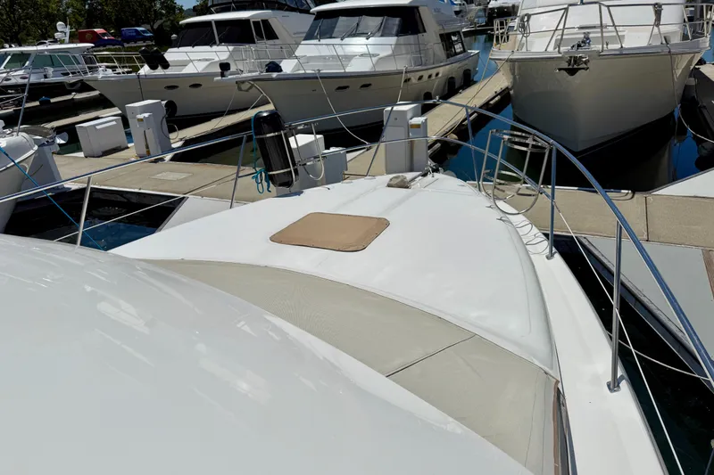 Slide: The Image of Docked 2000 Sea Ray 380 Aft Cabin yacht surrounded by other boats in a marina. - 42