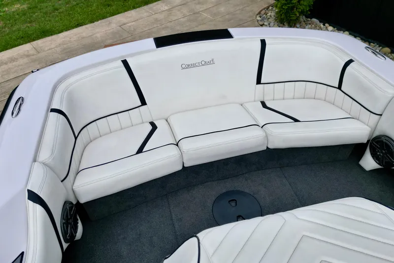 Slide: The Image of 1994 Nautique Ski Nautique boat interior with white seating and black accents. - 12