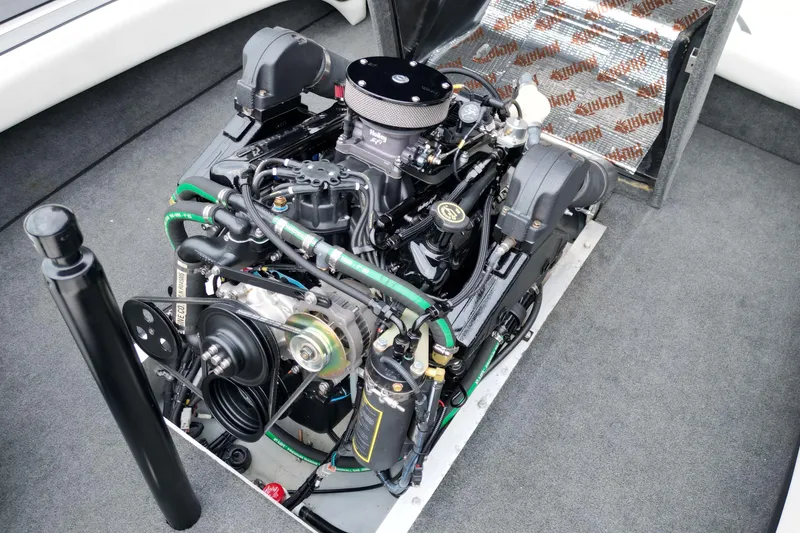 Slide: The Image of 1994 Nautique Ski Nautique engine compartment, showcasing a well-maintained marine engine. - 17