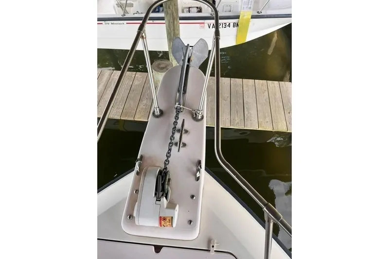 Slide: The Image of Bow view of 2002 Grady-White Gulfstream 232 with anchor and chain mechanism. - 11