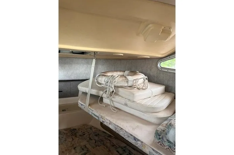 Slide: The Image of Interior cabin of 2002 Grady-White Gulfstream 232 with cushions and life preserver. - 13