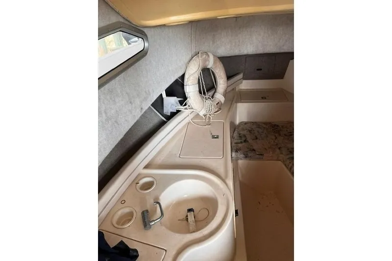 Slide: The Image of Interior of 2002 Grady-White Gulfstream 232 boat with sink and life preserver. - 15