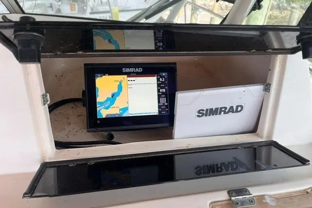 Slide: The Image of Simrad navigation system on 2002 Grady-White Gulfstream 232 boat dashboard. - 16