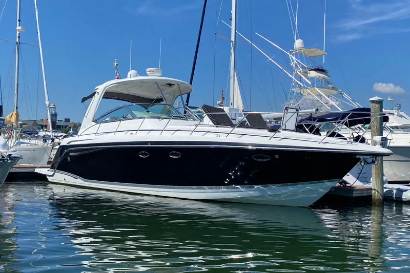 The Image of 2007 Formula 40 Performance Cruiser docked at marina under clear blue sky. - 0
