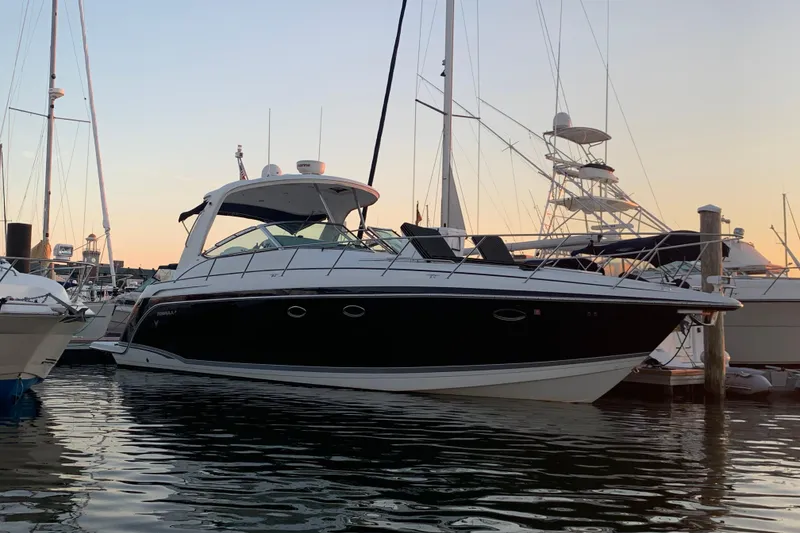 Slide: The Image of 2007 Formula 40 Performance Cruiser docked at sunset, showcasing sleek design and luxury features. - 1