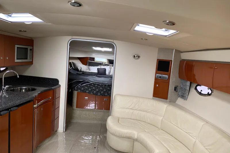 Slide: The Image of Interior of a 2007 Formula 40 Performance Cruiser with modern kitchen and cozy seating area. - 10