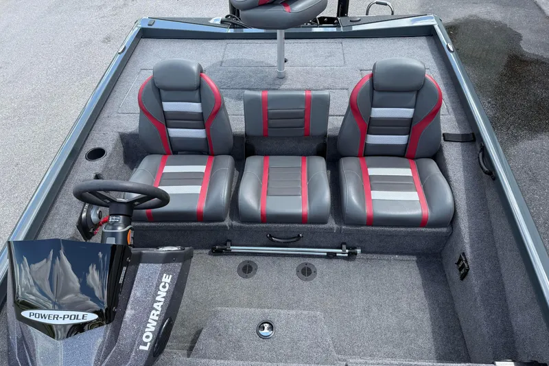 Slide: The Image of 2024 Ranger RT188P boat interior with gray and red seating, steering wheel, and Lowrance equipment. - 11
