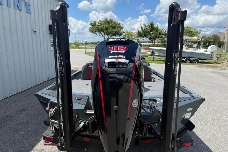 Slide: The Image of 2024 Ranger RT188P boat with Mercury 115 engine and Power-Pole anchors, parked outdoors. - 5