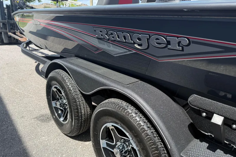 Slide: The Image of 2024 Ranger RT188P boat on trailer, showcasing sleek design and dual wheels. - 7