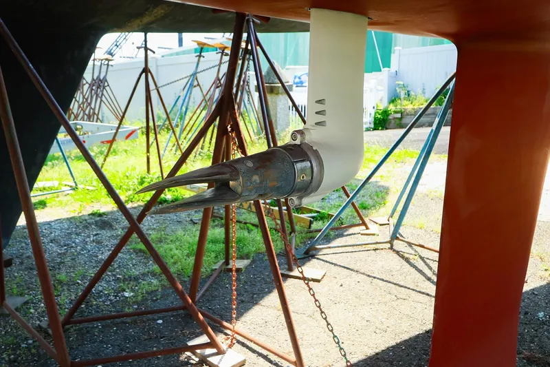 Slide: The Image of 2008 J Boats J/100 sailboat propeller and rudder detail in dry dock. - 22