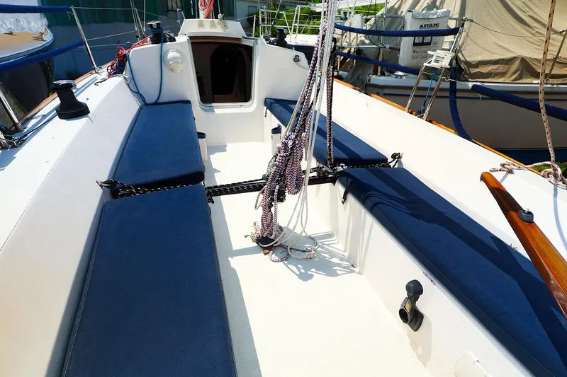 Slide: The Image of 2008 J Boats J/100 sailboat cockpit with blue cushions and rigging. - 13