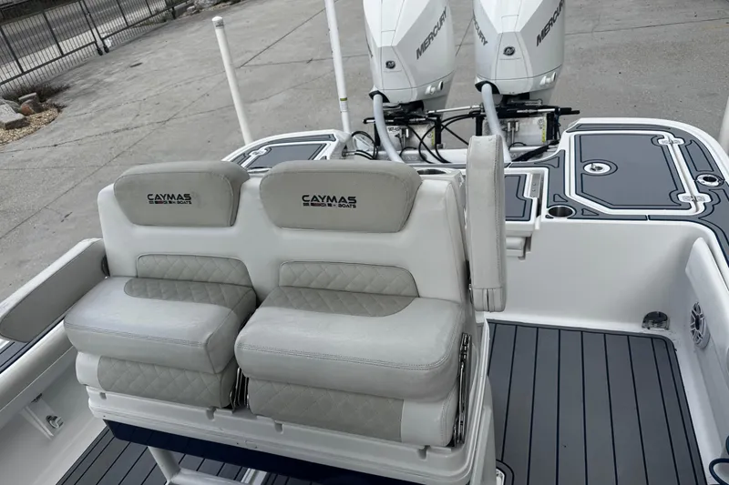 Slide: The Image of 2021 Caymas 28 HB boat interior with dual seats and Mercury engines. - 10