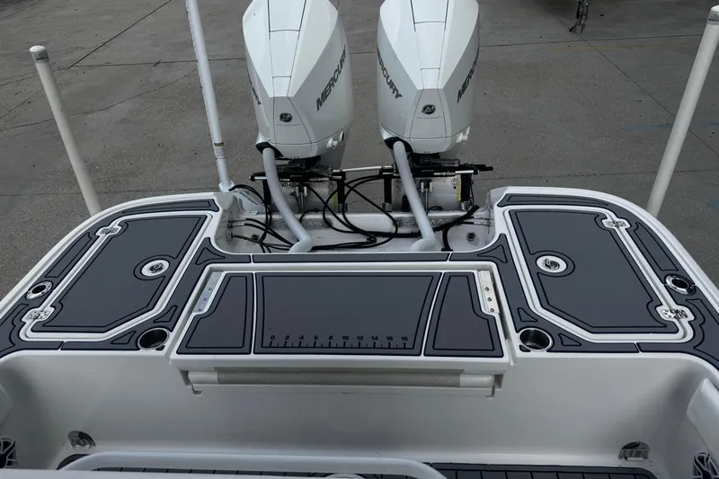 Slide: The Image of 2021 Caymas 28 HB boat with dual Mercury engines and sleek deck design. - 13
