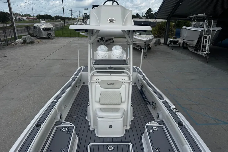 Slide: The Image of 2021 Caymas 28 HB boat with sleek design, spacious deck, and modern features. - 14