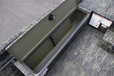 Slide: The Image of 2025 Lowe Roughneck 1860SC boat storage compartment with camouflage interior design. - 13