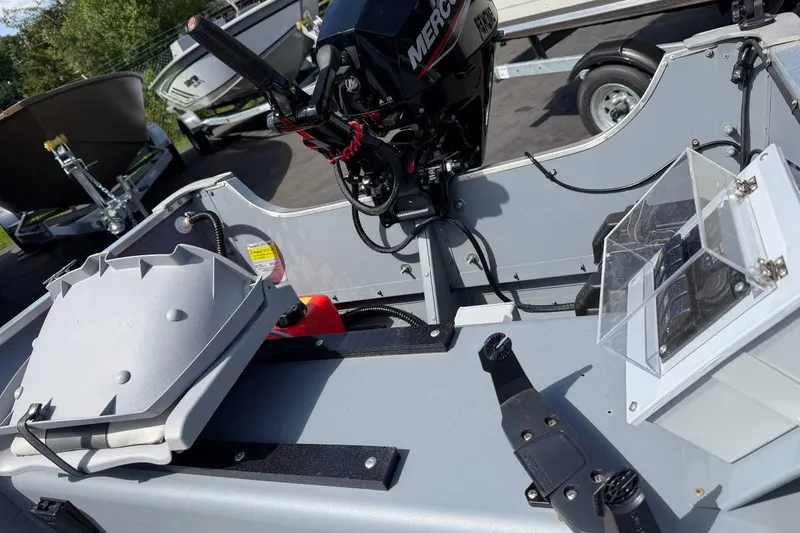Slide: The Image of 2023 Smoker Craft Alaskan 15 boat interior with Mercury engine and equipment. - 10