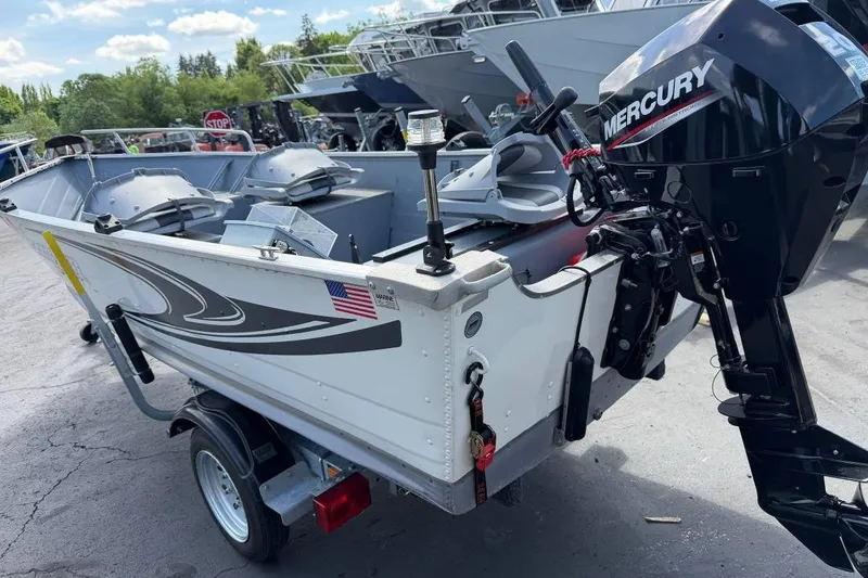 Slide: The Image of 2023 Smoker Craft Alaskan 15 boat with Mercury outboard motor on trailer. - 5