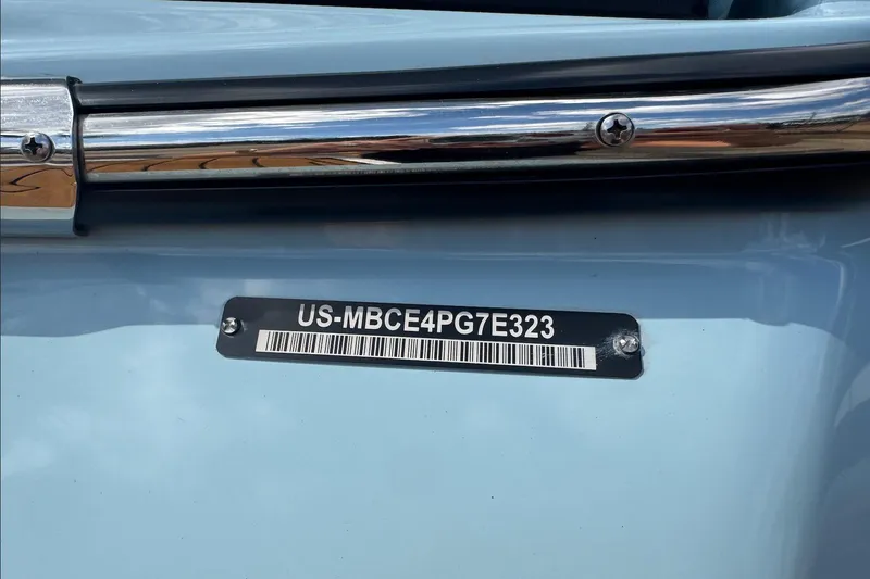 Slide: The Image of 2023 MasterCraft XT24 boat with visible hull identification number (HIN) plate. - 16