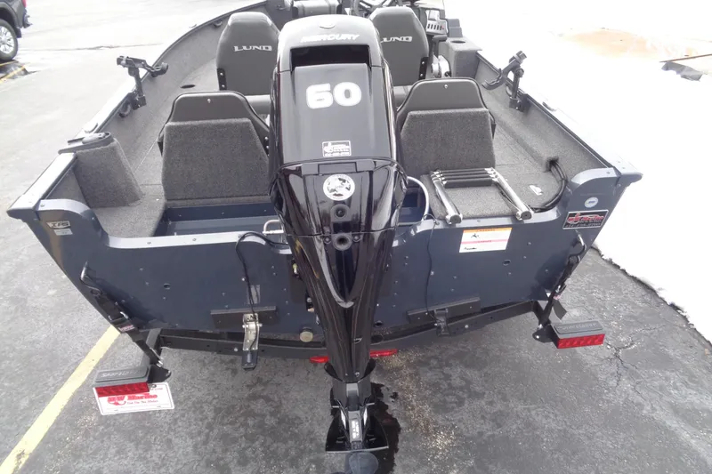 Slide: The Image of 2023 Lund 1650 Rebel XL SS boat with Mercury 60 engine, rear view. - 10