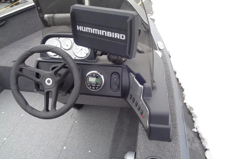 Slide: The Image of 2023 Lund 1650 Rebel XL SS boat dashboard with Humminbird fish finder. - 12