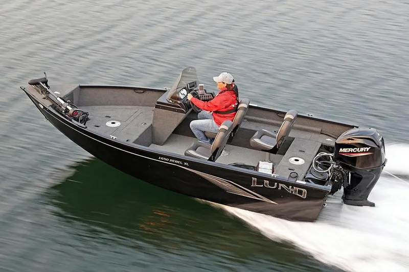 Slide: The Image of Manufacturer Provided Image: 2023 Lund 1650 Rebel XL SS boat cruising on water with Mercury outboard engine. - 17