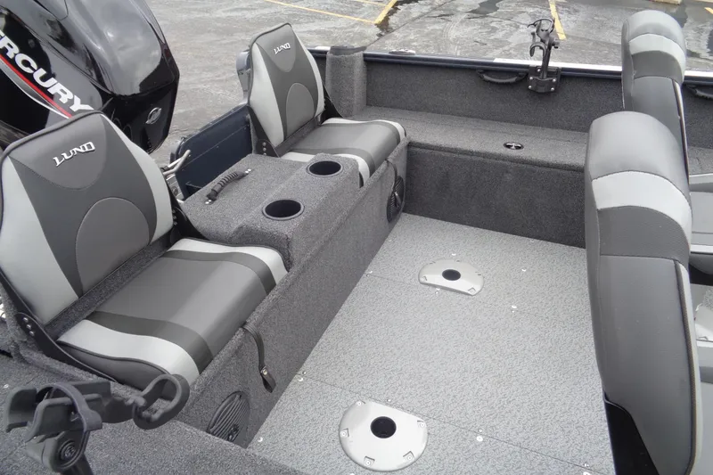 Slide: The Image of 2023 Lund 1650 Rebel XL SS boat interior with seating and cup holders. - 19