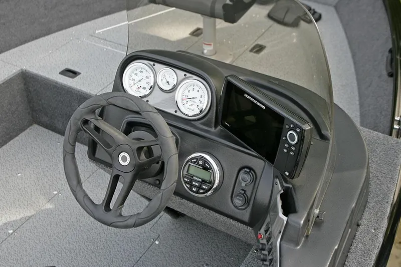 Slide: The Image of Manufacturer Provided Image: 2023 Lund 1650 Rebel XL SS boat dashboard with steering wheel and gauges. - 23