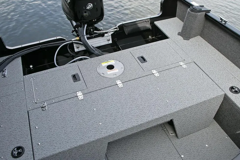 Slide: The Image of Manufacturer Provided Image: 2023 Lund 1650 Rebel XL SS boat interior with storage compartments and motor. - 24