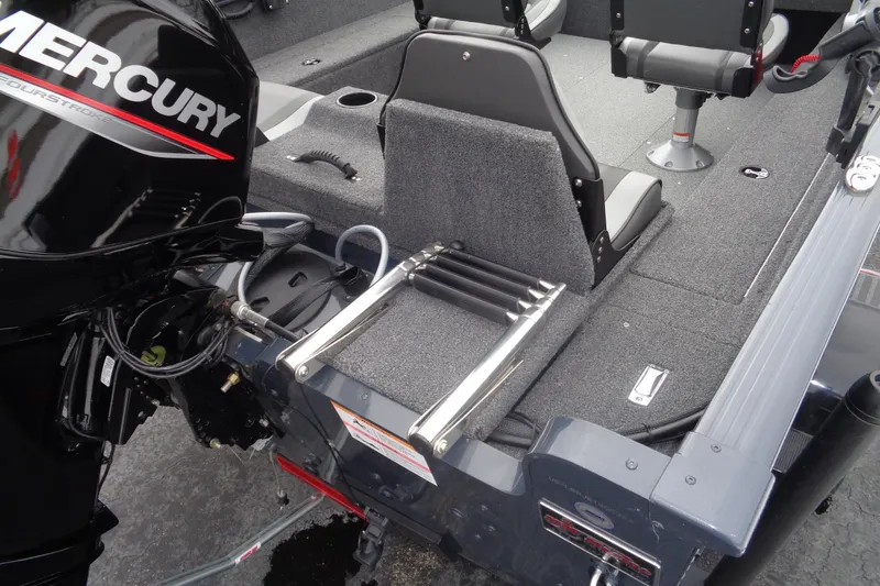 Slide: The Image of 2023 Lund 1650 Rebel XL SS boat interior with Mercury engine and foldable ladder. - 6