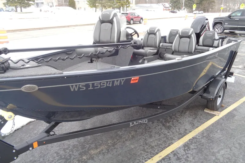 Slide: The Image of 2023 Lund 1650 Rebel XL SS fishing boat on trailer in parking lot. - 7