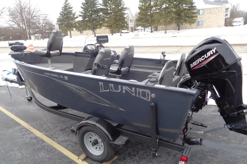 Slide: The Image of 2023 Lund 1650 Rebel XL SS fishing boat with Mercury outboard motor on trailer. - 9
