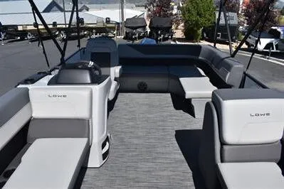 Slide: The Image of 2025 Lowe LS 170 pontoon boat interior with spacious seating and modern design. - 13