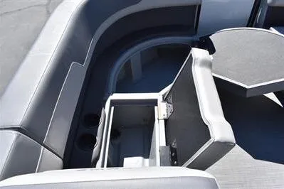 Slide: The Image of 2025 Lowe LS 170 boat interior with open storage compartment and seating area. - 16