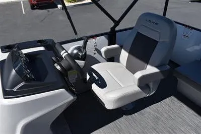 Slide: The Image of 2025 Lowe LS 170 boat interior with steering console and comfortable seating. - 24