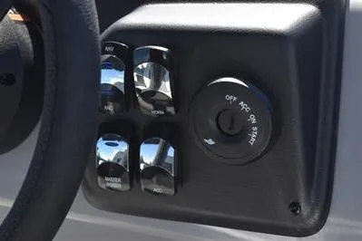 Slide: The Image of Control panel of 2025 Lowe LS 170 boat with ignition switch and buttons. - 28
