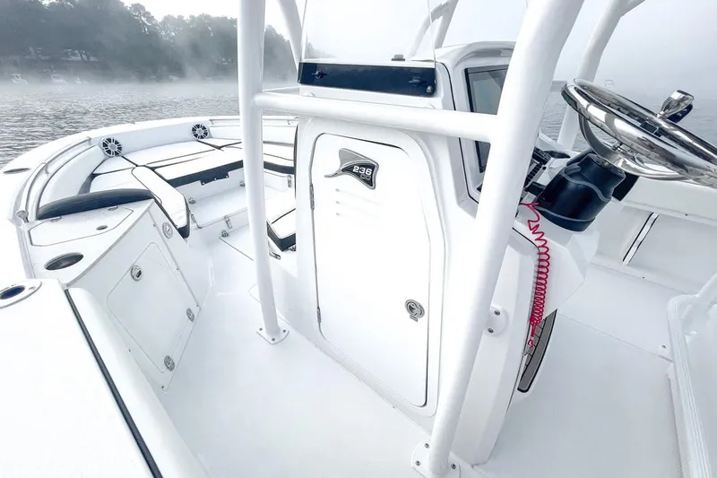 Slide: The Image of Interior of 2026 Stingray 236 CC boat on misty water. - 10