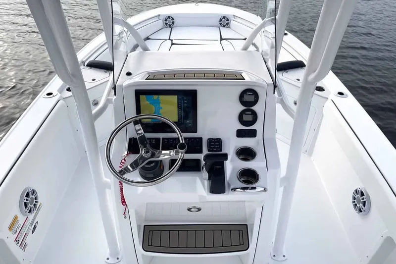 Slide: The Image of Interior view of 2026 Stingray 236 CC boat with helm console. - 11